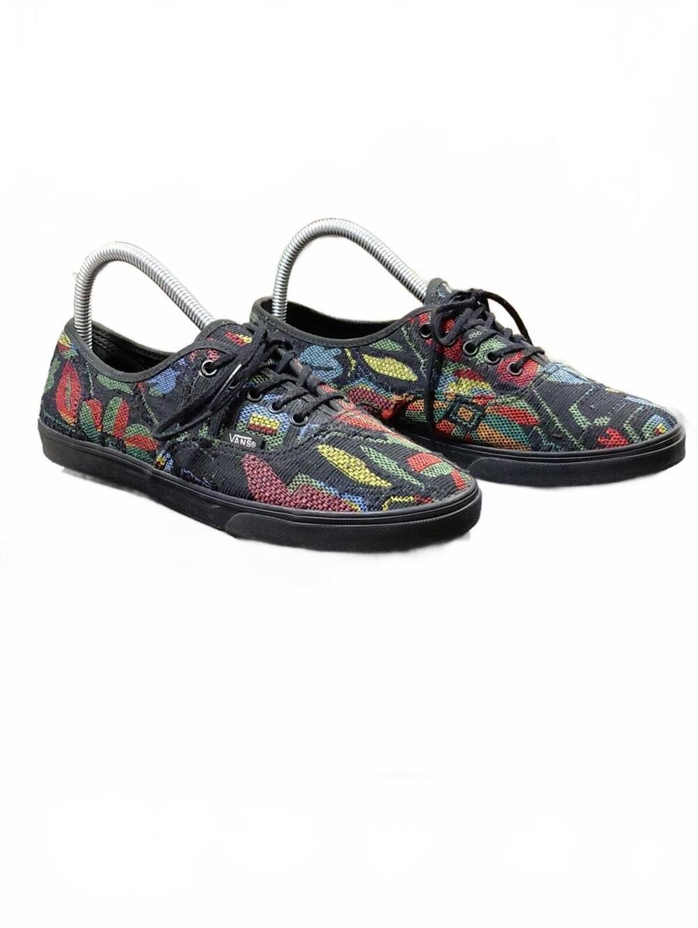"Vans" Unisex Black Low-Top Sneakers with Multicolor Floral Tapestry Motif.